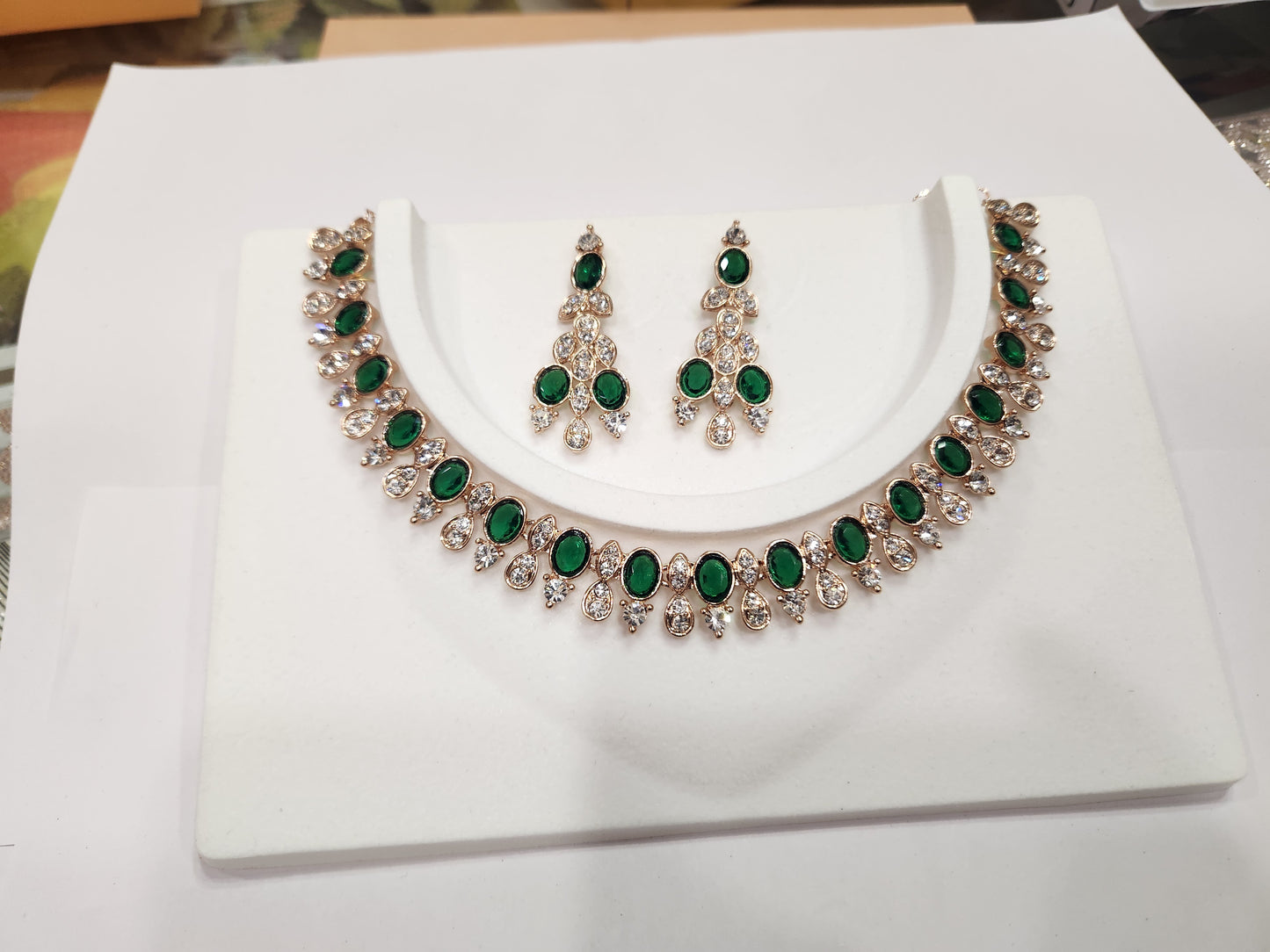 Classy American diamond choker set with green and white gemstone earrings, perfect for any attire.