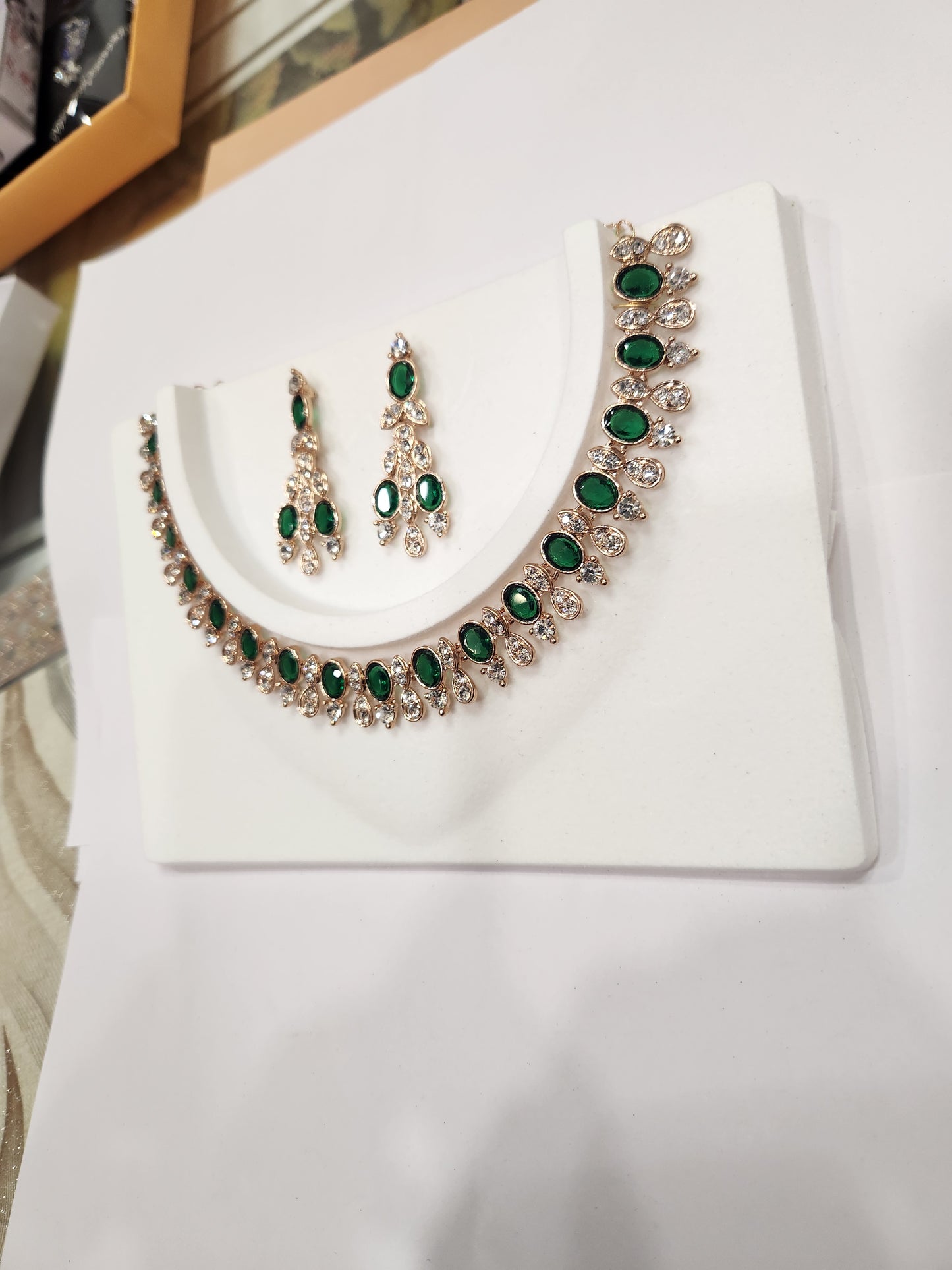 Classy American diamond choker set with green and white gemstone earrings, perfect for any attire.