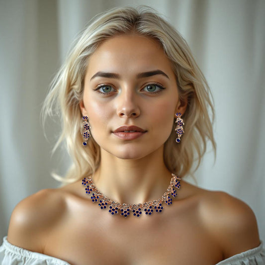 Elegant blue and white rhinestone studded necklace set with long drop earrings having flower shaped  pieces